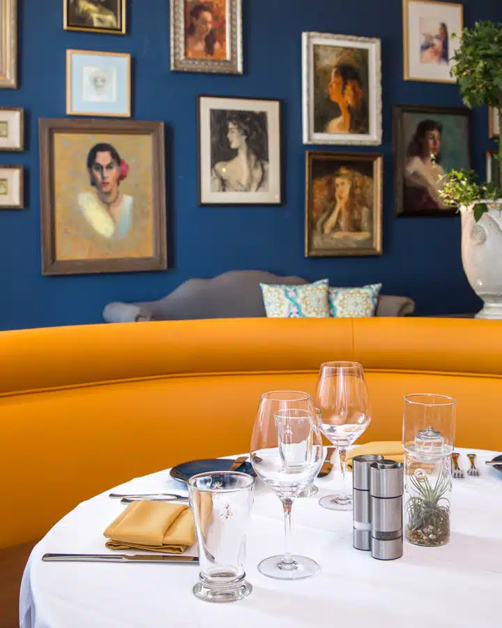 Sofitel_Restaurant A group of people sitting at a table posing for the camera