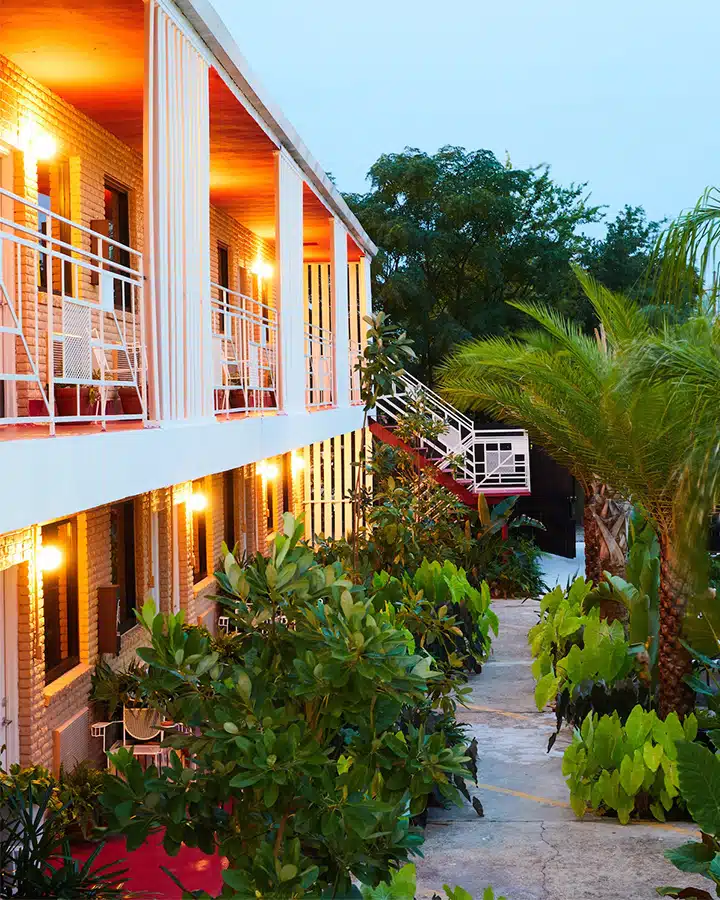 THE-DRIFTER_Exterior-Rooms_Nicole-Franzen-for-Design-Hotels-720x900 A train is parked on the side of a building