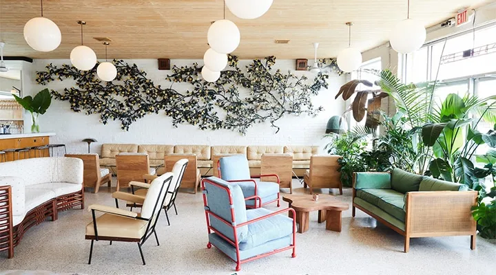 THE-DRIFTER_Lobby-Bar-03_Nicole-Franzen-for-Design-Hotels-720x400 A living room filled with furniture and vase on a table