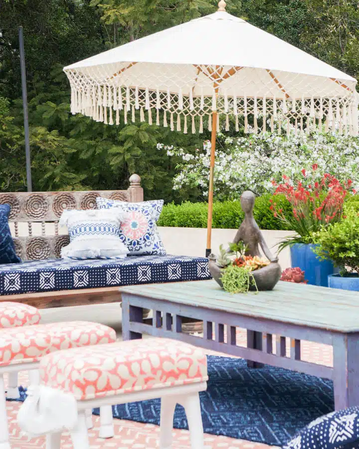 Terrace_-_Staged_Spaces-720x900 A group of people sitting at a table with an umbrella