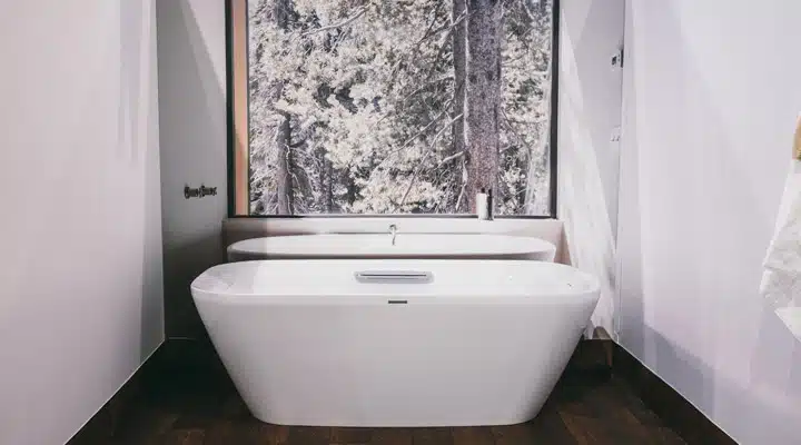 Tub A bedroom with a shower and a sink