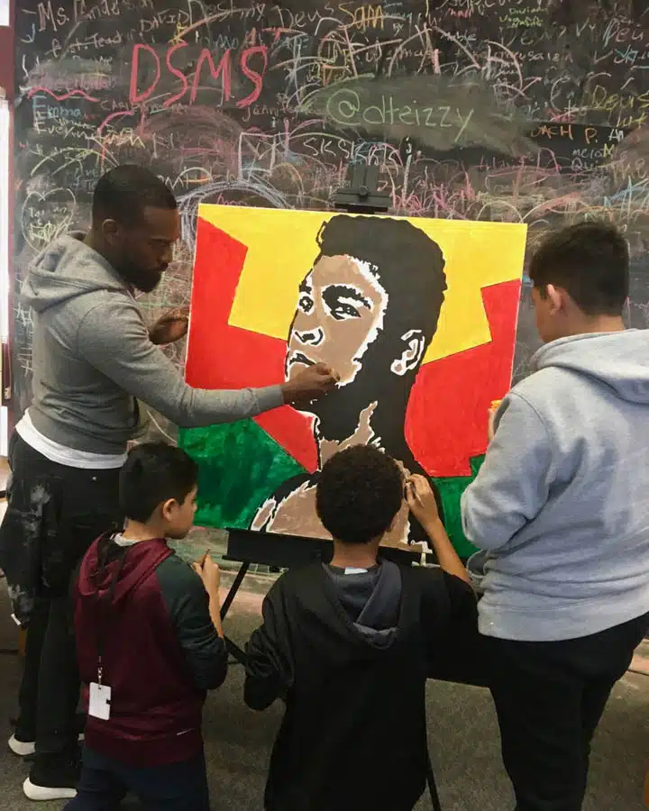 Tysen_Knight3-720x900 A group of people standing in front of a crowd