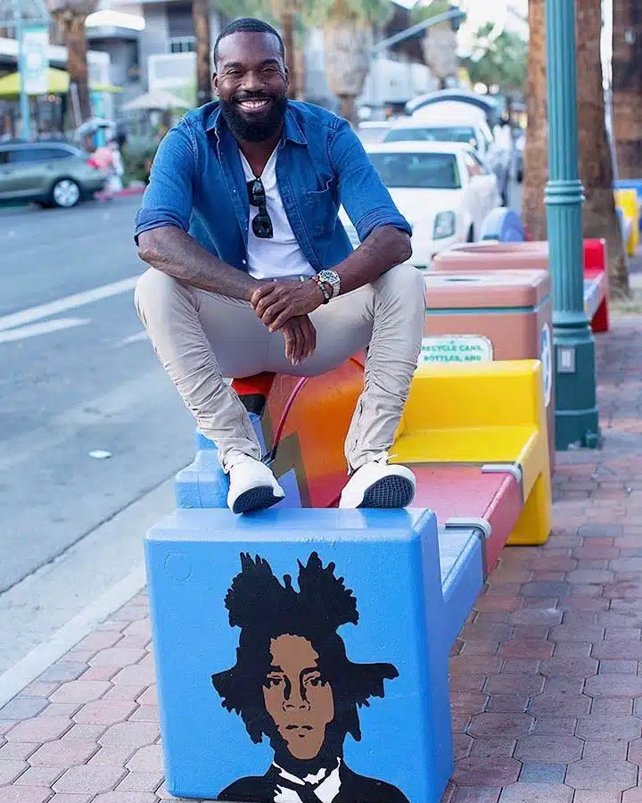 Tysen_Knight5-720x900 A person sitting on a sidewalk