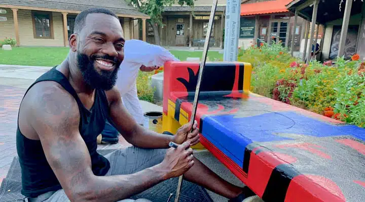 Tysen_Knight7-720x400 A man sitting in front of a building