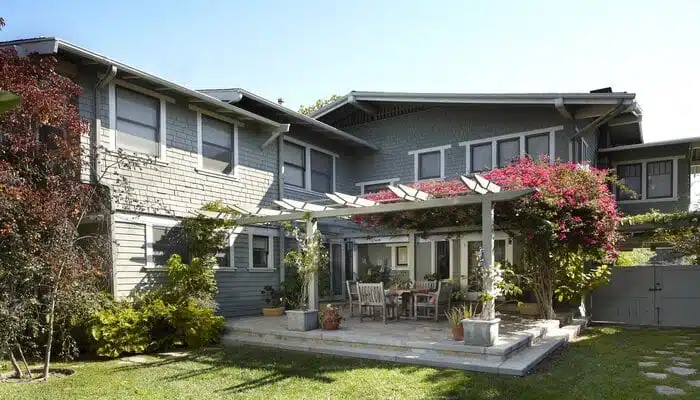 craftsman-house-colors-back-exterior A large brick building with grass in front of a house