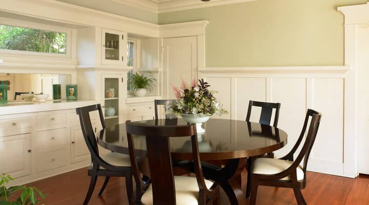 A dining room table in front of a window