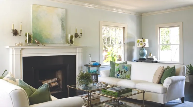 A living room filled with furniture and a fire place