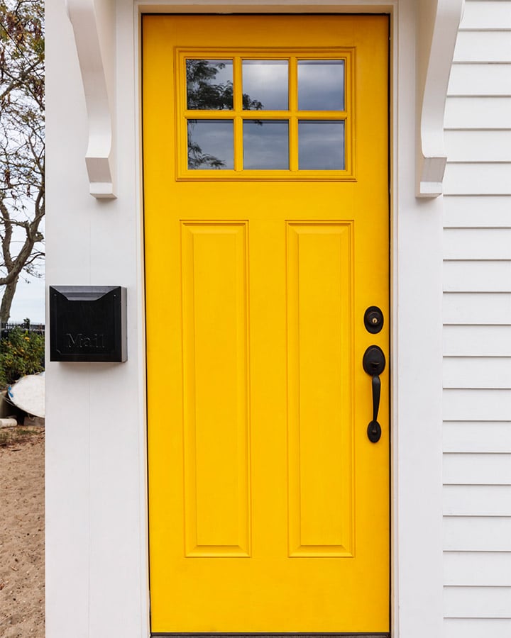 A door is open in front of a house