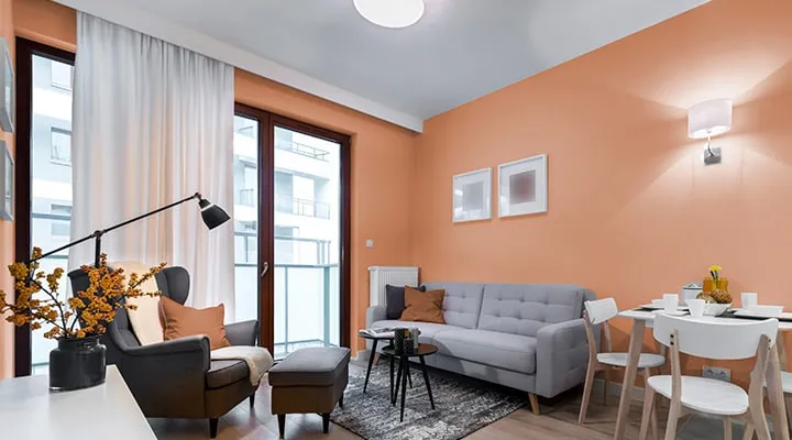 iStock-909606678-2-720x400 A living room filled with furniture and a large window