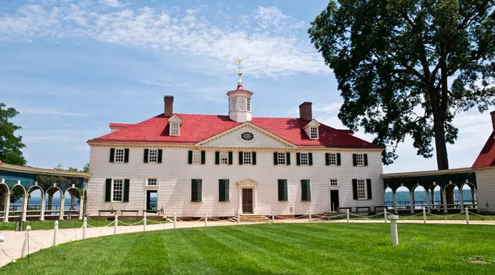 iStock_000014161469_Large A small clock tower in the middle of a field with Mount Vernon in the background