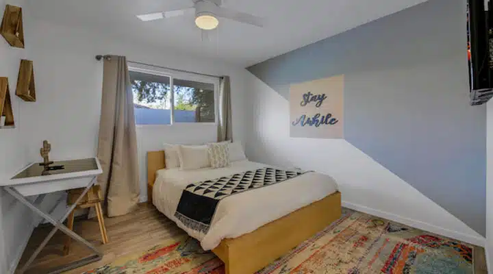 image1-720x400 A bedroom with a bed in a room