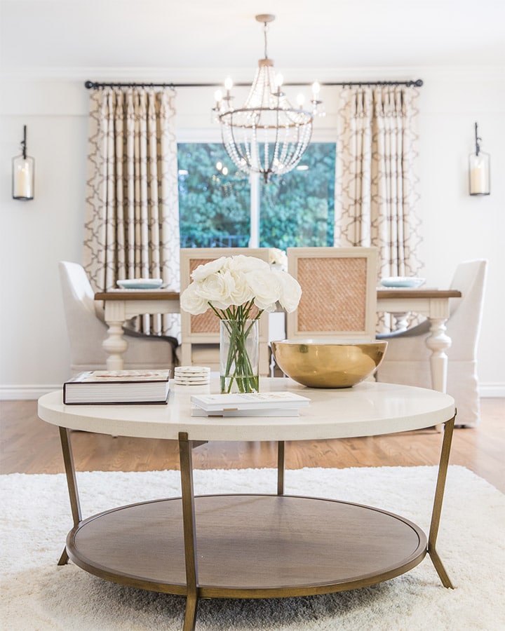A room filled with furniture and vase on a table