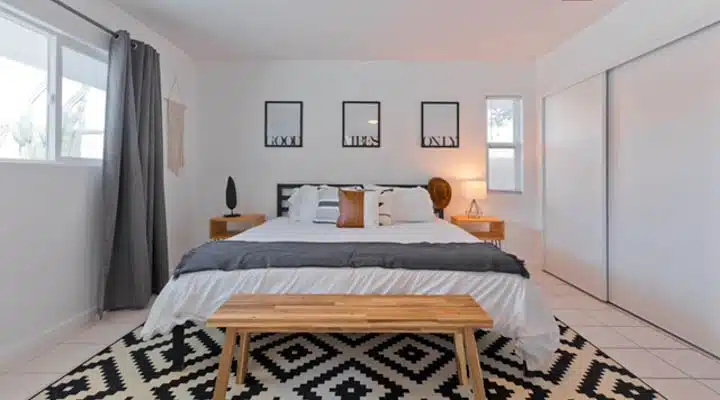 image7-720x400 A bedroom with a bed in a room