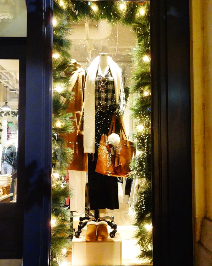 A person standing in front of a window