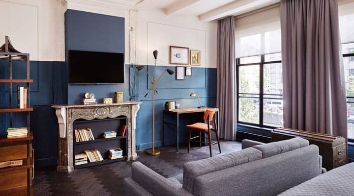 A living room filled with furniture and a large window