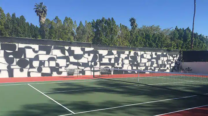 tennis-view-2_720x400 A person on a court with a racquet