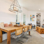 A living room filled with furniture and a large window