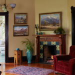 A living room filled with furniture and a fire place