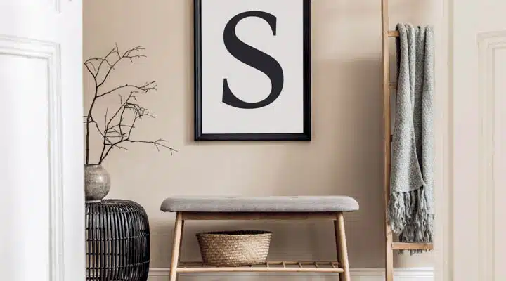 Japandi style living room with mock up poster frame, design wood A chair sitting in front of a window