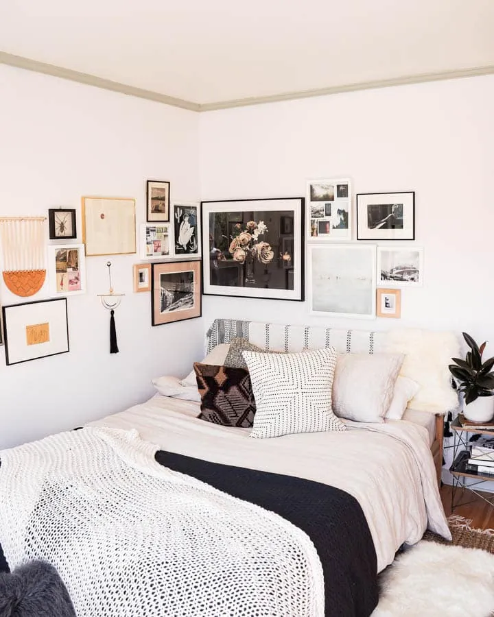 A bedroom with a bed in a room