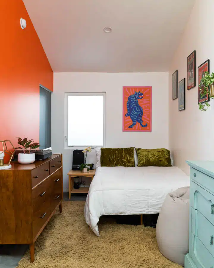 _DSC0295-720x900 A bedroom with a bed and desk in a small room