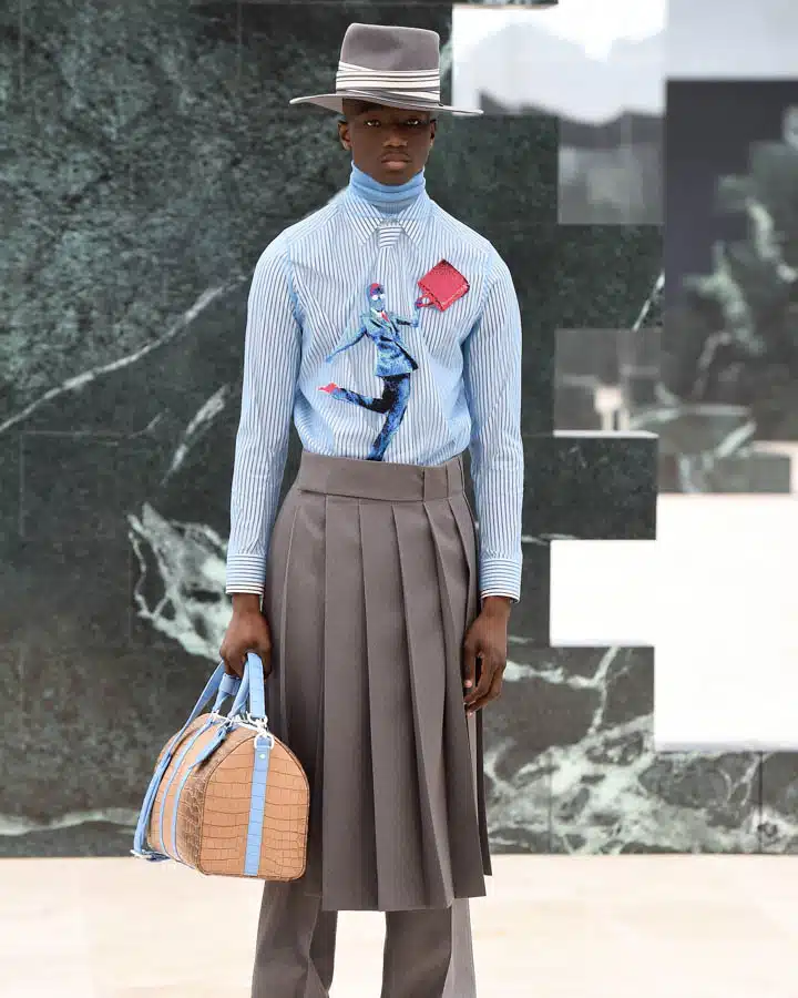 Louis Vuitton : Runway - Paris Fashion Week - Menswear F/W 2021-2022 A man standing in front of a building
