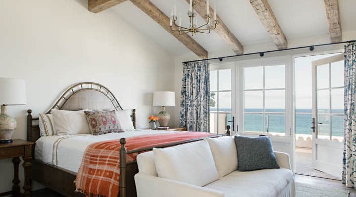 A living room filled with furniture and a large window
