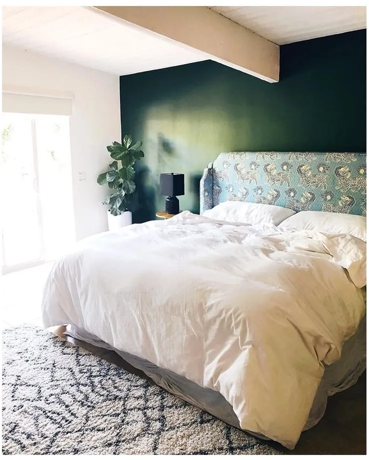 A made bed in a bedroom