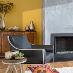 A living room filled with furniture and a fire place