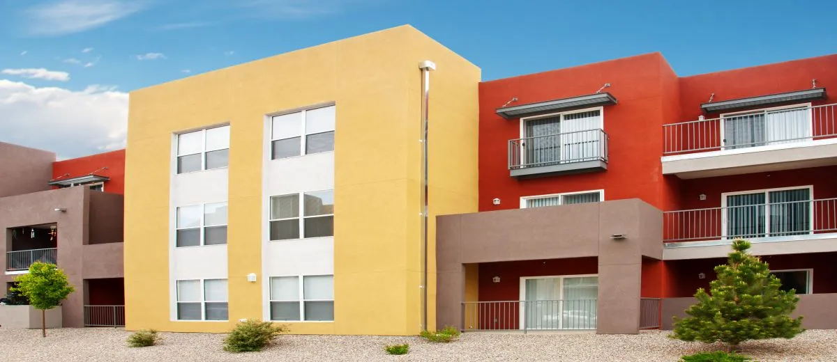 A house in front of a brick building