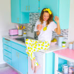 A woman standing in a kitchen