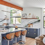 A kitchen with an island in the middle of a room