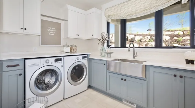 A kitchen with a stove top oven sitting next to a window