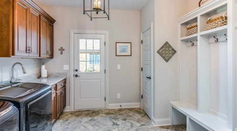 A kitchen with a sink and a mirror