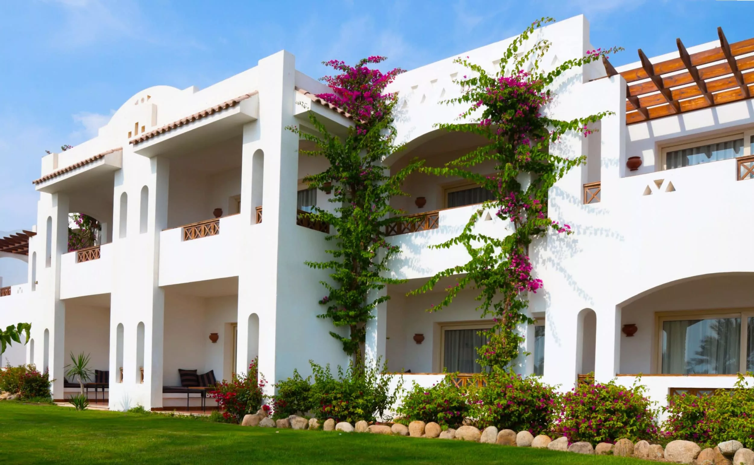 A house with trees in front of a building