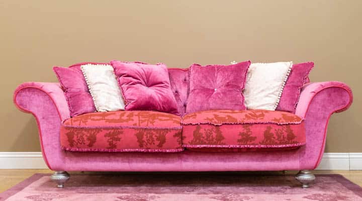 A brown leather couch in a living room