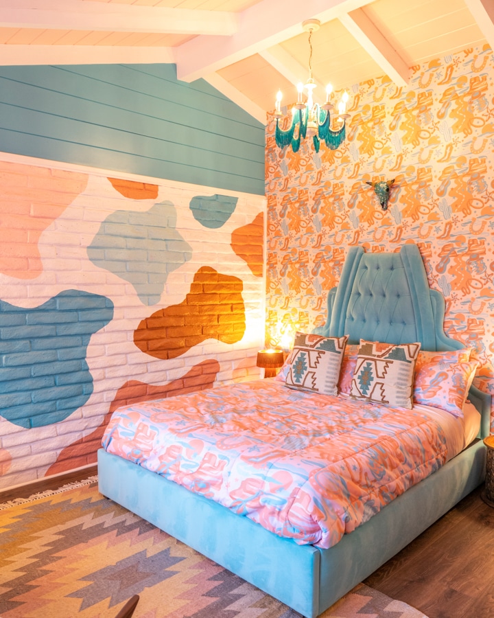 A bedroom with a bed and painted