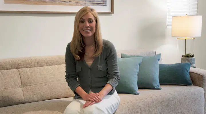 A woman sitting on a sofa