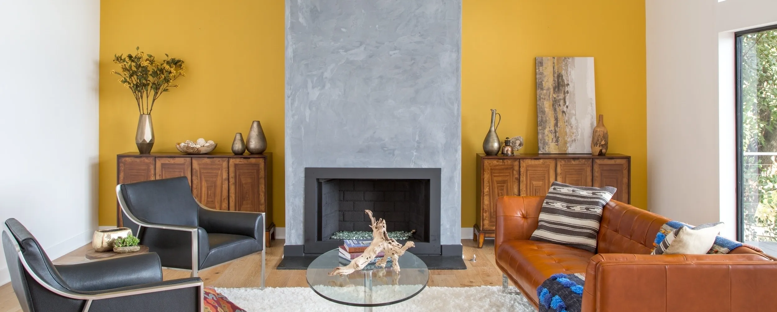 A living room filled with furniture and a fire place