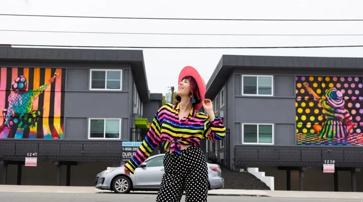 A person standing in front of a building