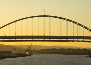 A train crossing a bridge over a body of water