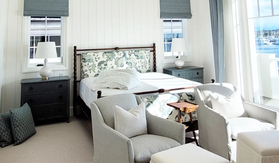 A living room with a bed and a window