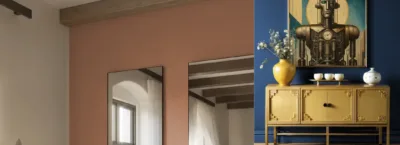 A bedroom with a house in the background