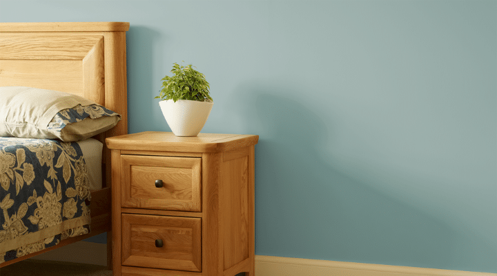 A bedroom with a bed and a mirror