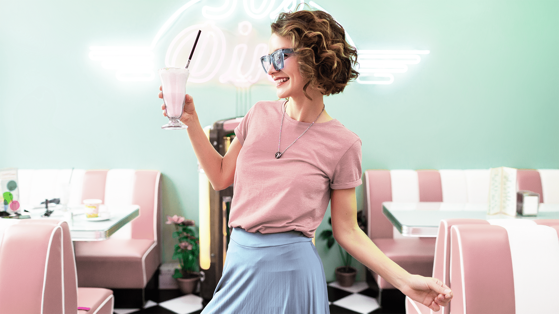 A woman holding a wii remote