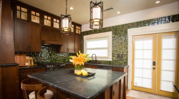 A vase of flowers on a kitchen counter