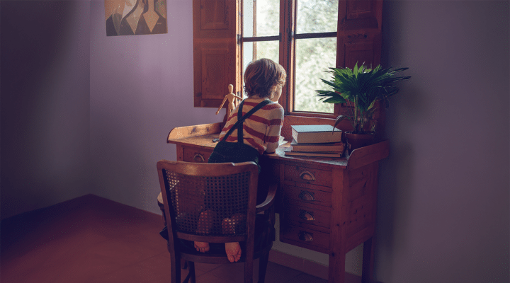 A person sitting on a chair in a room