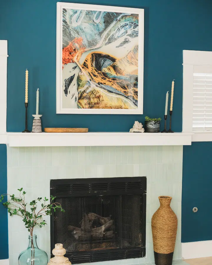 A painting of a fire place sitting in a living room