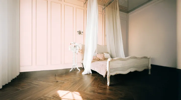 A bedroom with a bed in a room