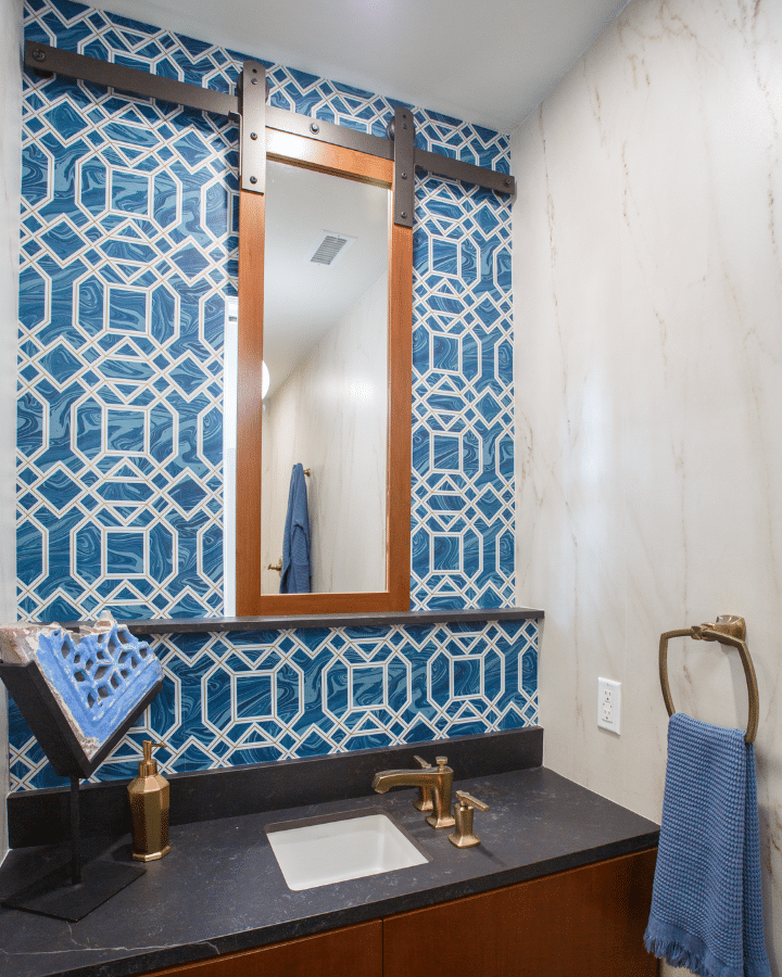 A room with a sink and a mirror